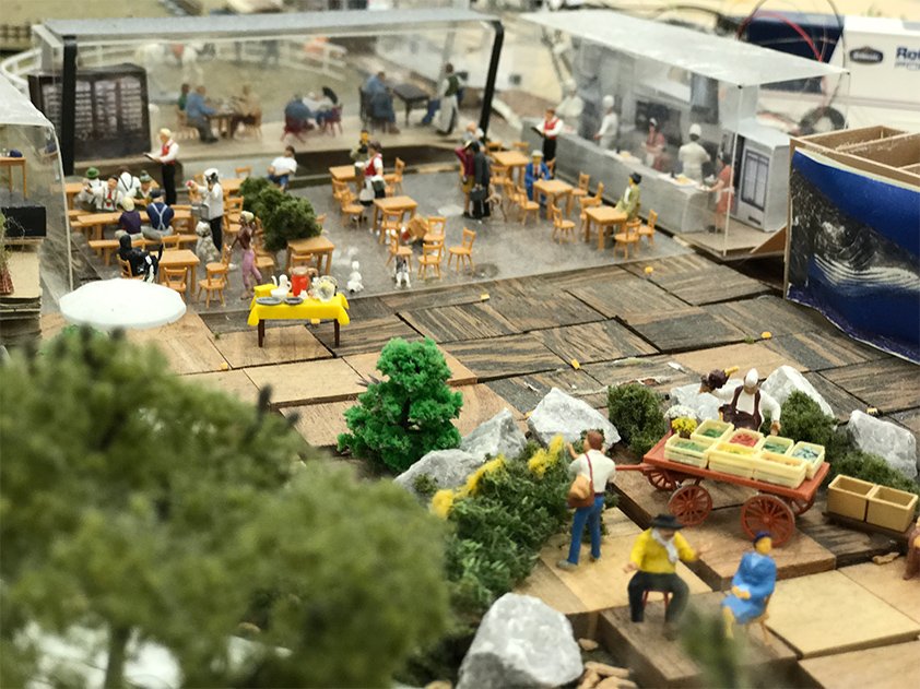 A site model showing the deck, trailers and seating.